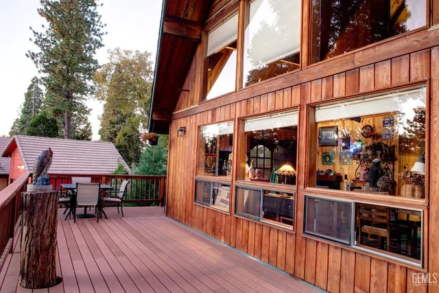 a view of balcony with deck and wooden floor