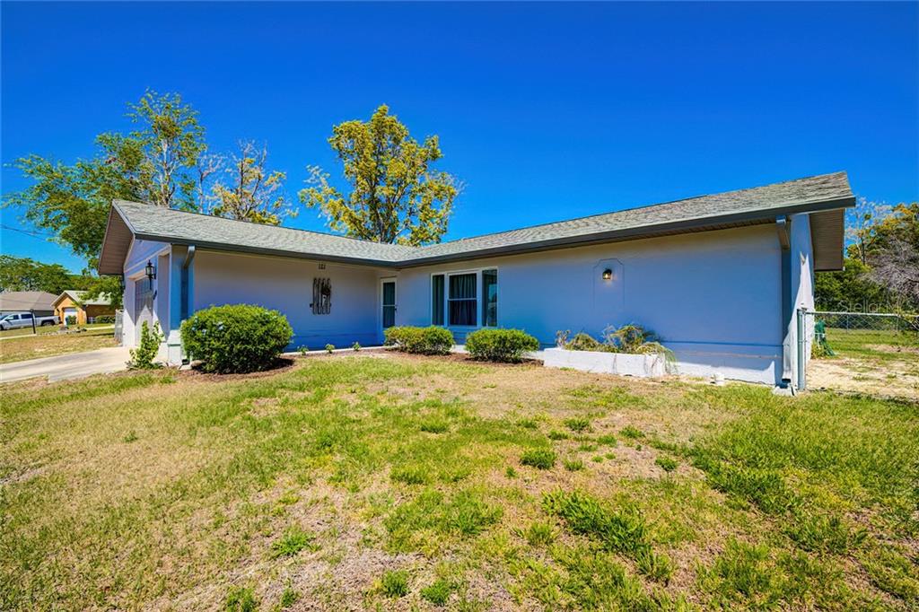 4530 Gondolier Road Spring Hill, FL 34609 - Photo 1 of 1 a view of a house with a yard