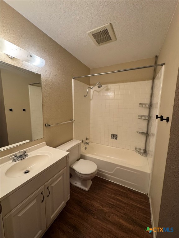 815 Burges Street Seguin, TX 78155 - Photo 8 of 10 a bathroom with a double vanity sink toilet a mirror and shower
