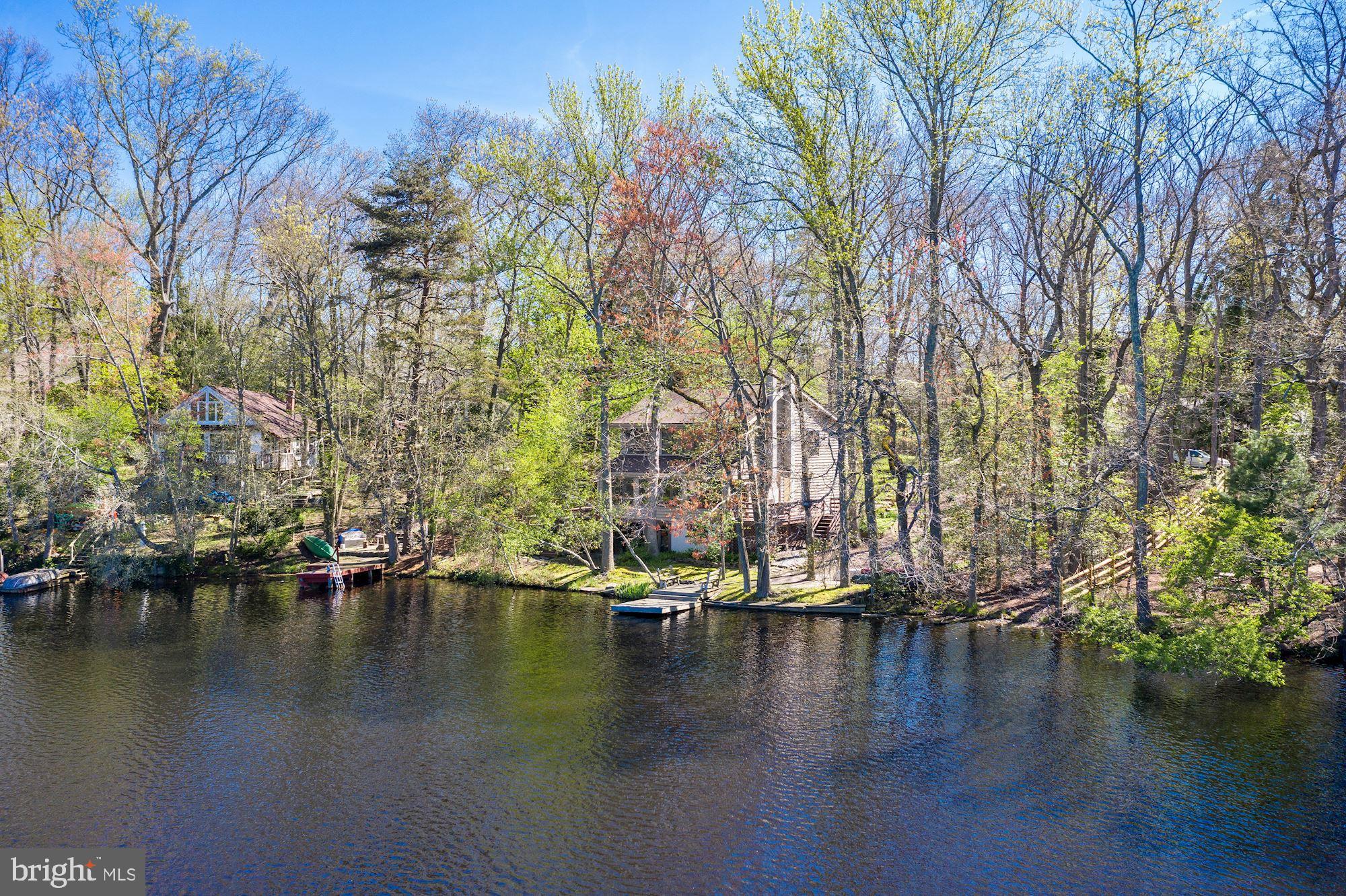 8 Robinson Road Medford, NJ 08055 - Photo 16 of 55 a view of water with boats and trees in the background