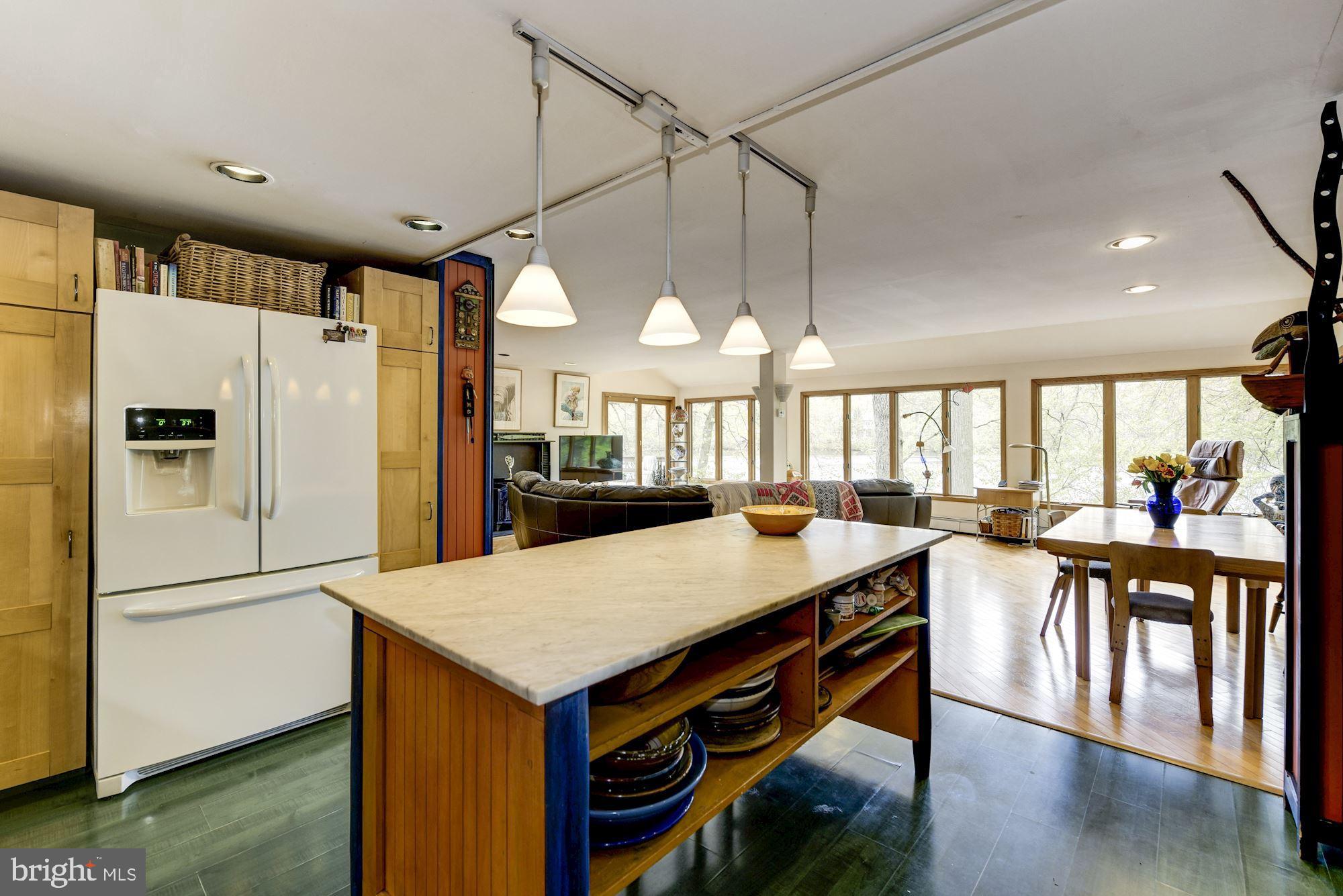8 Robinson Road Medford, NJ 08055 - Photo 35 of 55 a kitchen with a table chairs refrigerator and cabinets