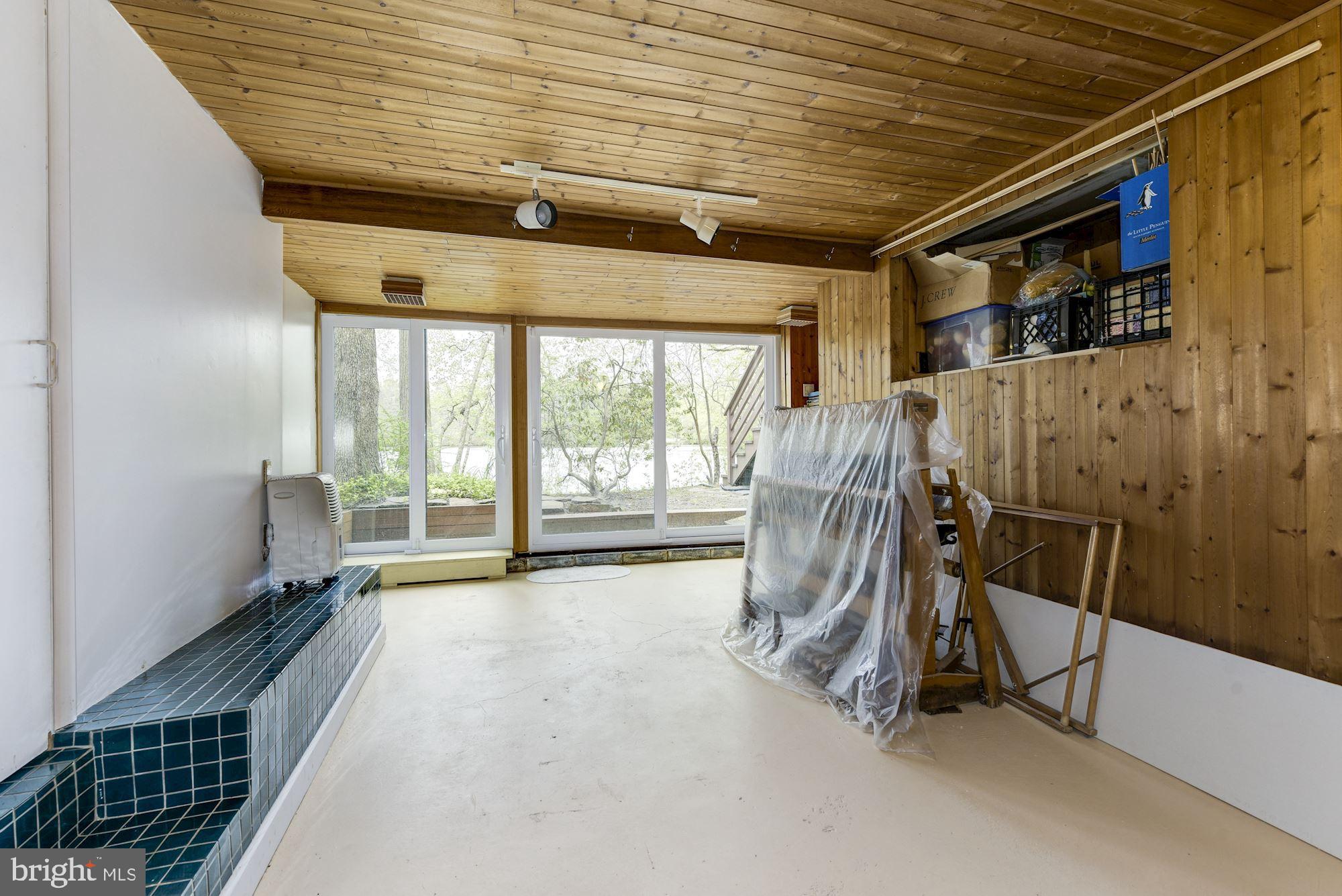 8 Robinson Road Medford, NJ 08055 - Photo 50 of 55 a view of an empty room with wooden floor and chair