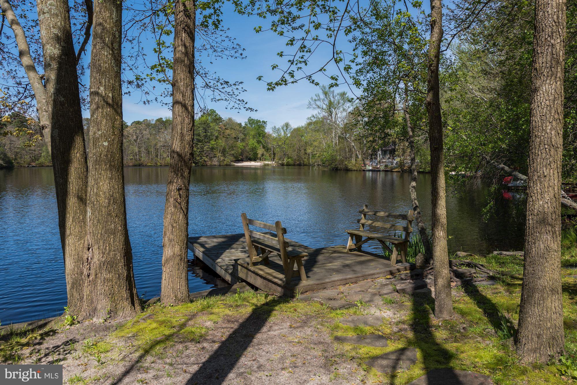 8 Robinson Road Medford, NJ 08055 - Photo 51 of 55 a view of a lake with a house in the background