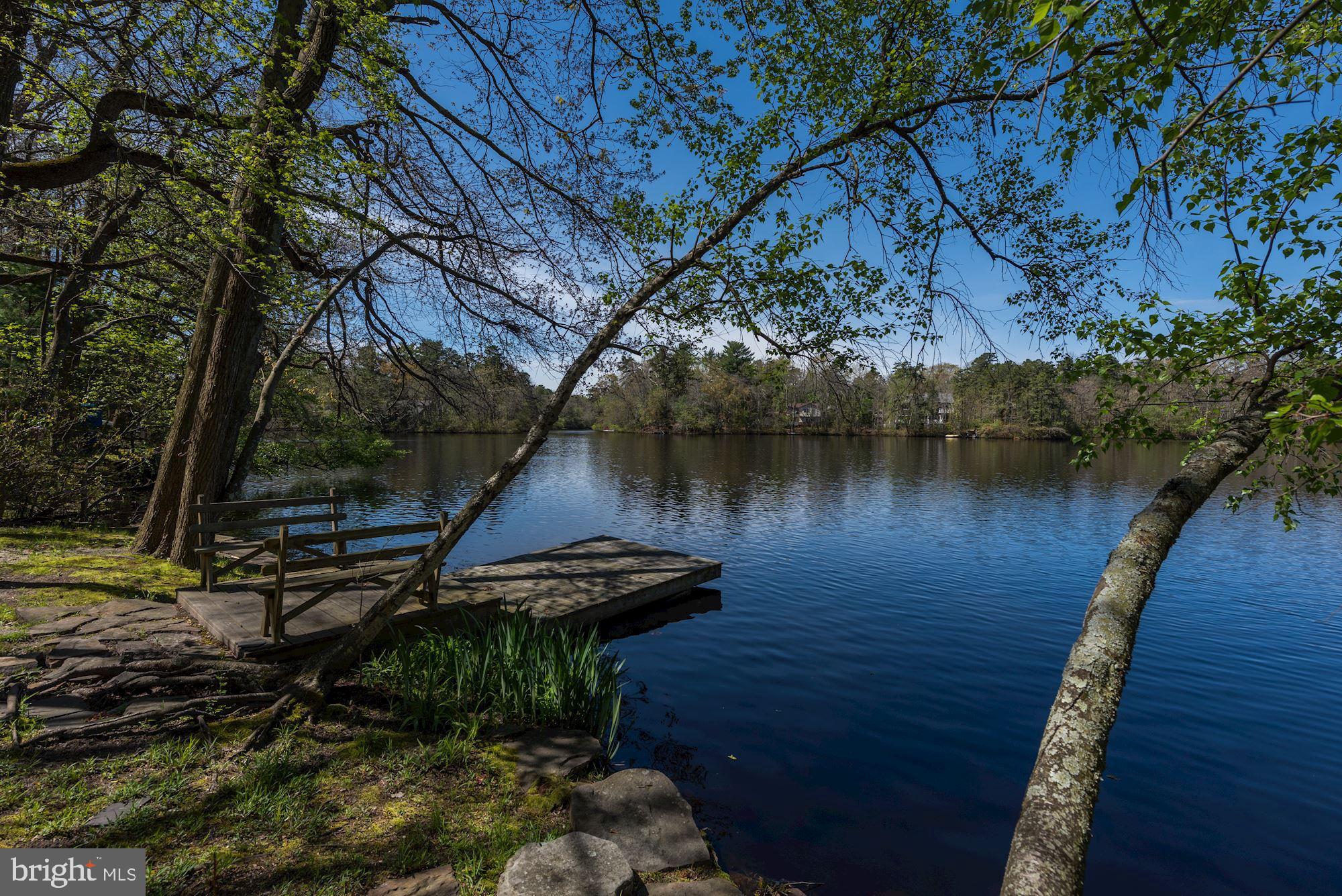 8 Robinson Road Medford, NJ 08055 - Photo 52 of 55 a view of a lake with a bench