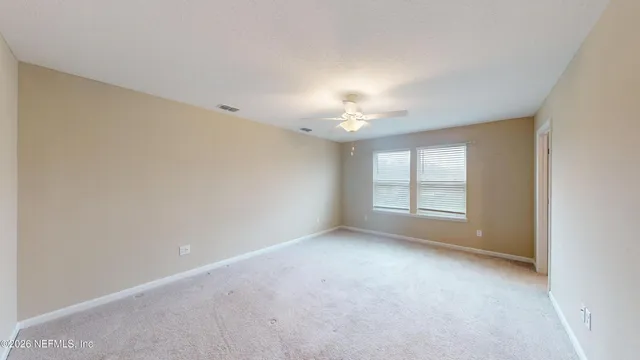 a bathroom with double vanity sinks and a mirror