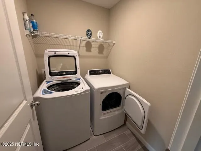a utility room with dryer and washer