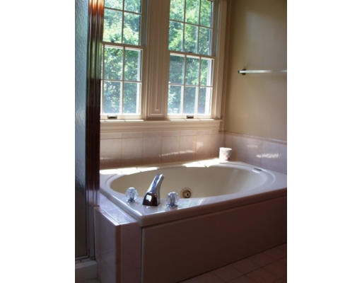 6 Partridge Way Canton, MA 02021 - Photo 15 of 25 a bath tub sitting in a bathroom next to a window