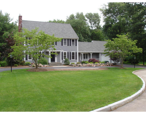 6 Partridge Way Canton, MA 02021 - Photo 2 of 25 a front view of a house with a garden