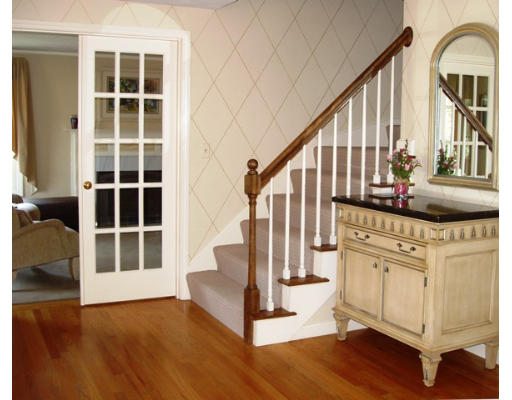 6 Partridge Way Canton, MA 02021 - Photo 5 of 25 a view of front door with wooden floor and stairs