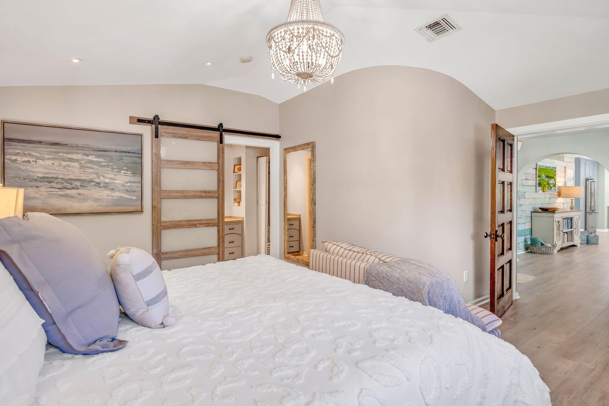 56 Colson Drive Cudjoe, FL 33042 - Photo 11 of 50 a bedroom with a large bed and a chandelier