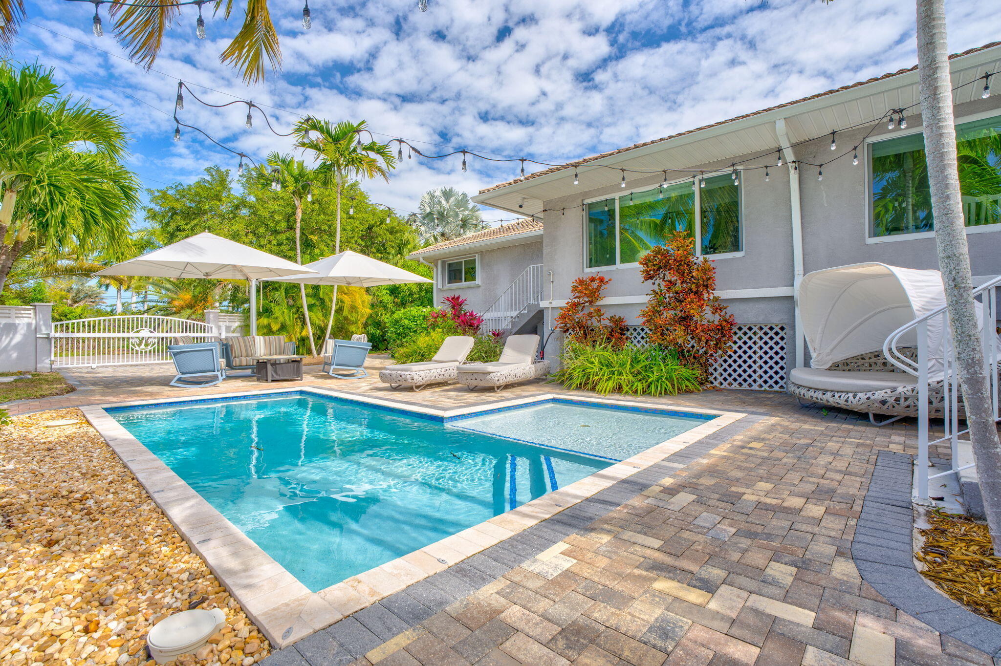 56 Colson Drive Cudjoe, FL 33042 - Photo 26 of 50 a view of a backyard with furniture and a swimming pool
