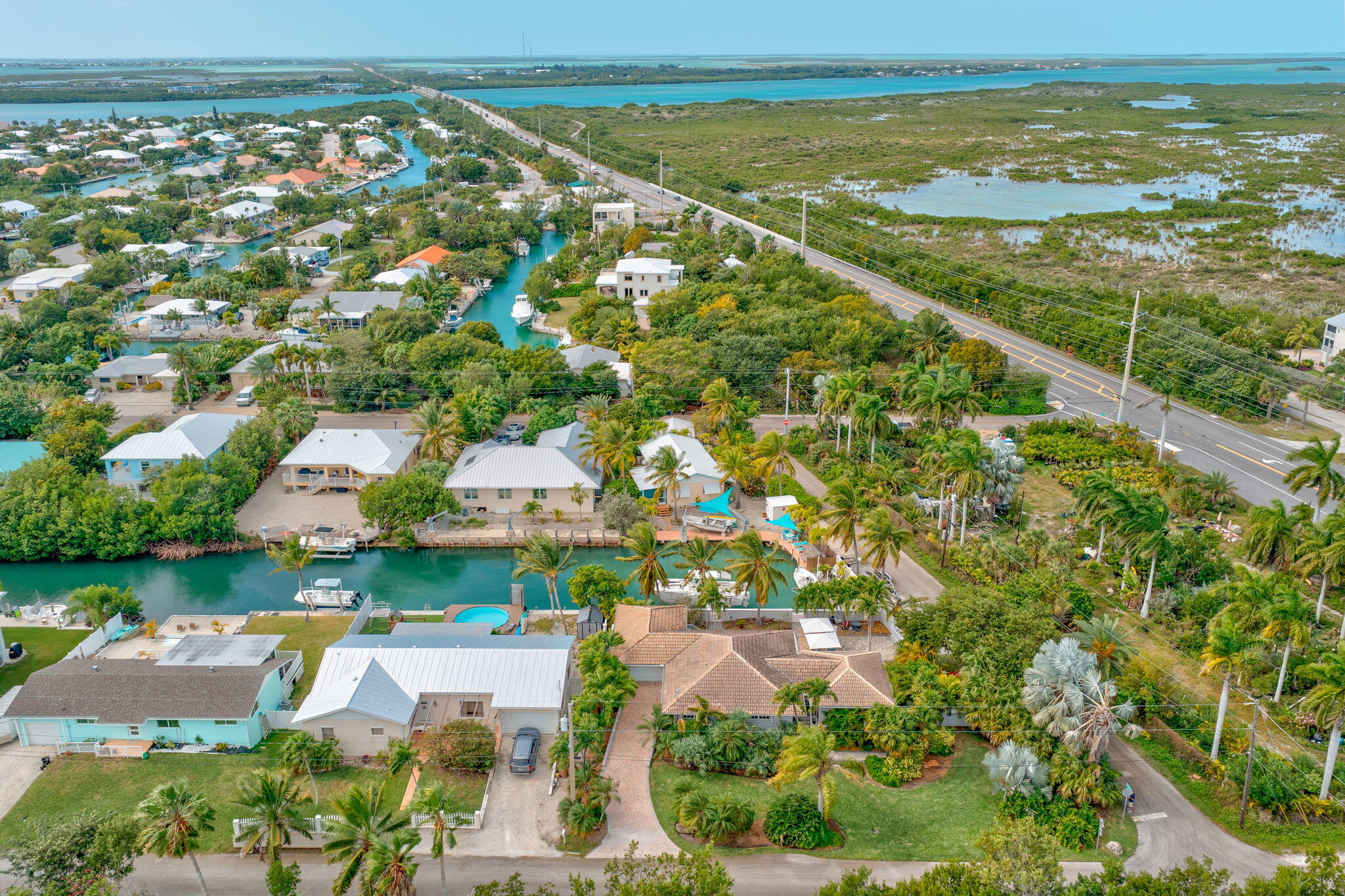 56 Colson Drive Cudjoe, FL 33042 - Photo 40 of 50 an aerial view of residential houses with outdoor space and swimming pool