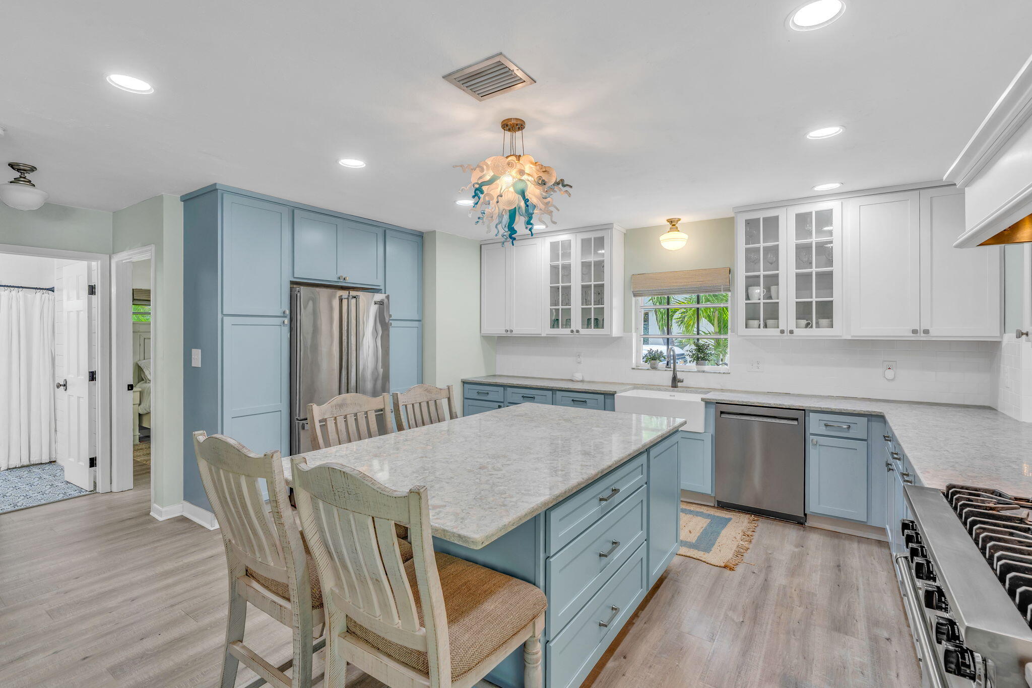 56 Colson Drive Cudjoe, FL 33042 - Photo 5 of 50 a kitchen with stainless steel appliances granite countertop a kitchen island hardwood floor sink stove and granite counter top
