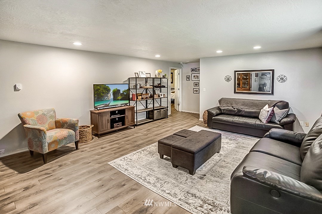 923 Newberg Road Snohomish, WA 98290 - Photo 3 of 22 a living room with furniture and a flat screen tv