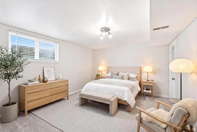 215 Carol Way Midvale, UT 84047 - Photo 22 of 30 Bedroom with light colored carpet and baseboards