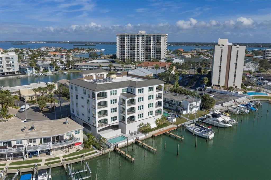 211 Dolphin Point, Unit 1 Clearwater Beach, FL 33767 - Photo 14 of 16 a large building with a lots of windows in it