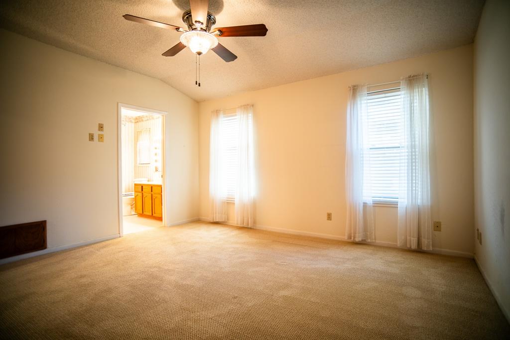 8312 Llano Avenue Benbrook, TX 76116 - Photo 12 of 40 a view of an empty room with a window