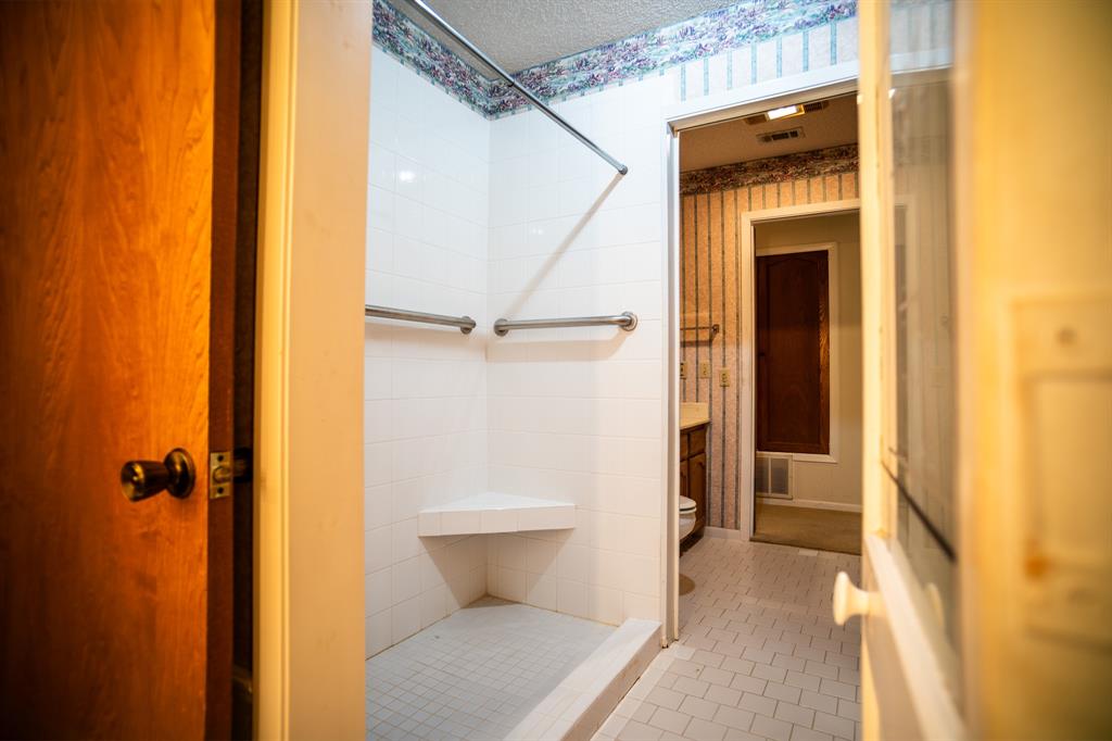 8312 Llano Avenue Benbrook, TX 76116 - Photo 15 of 40 a view of a bathroom with a sink and a toilet