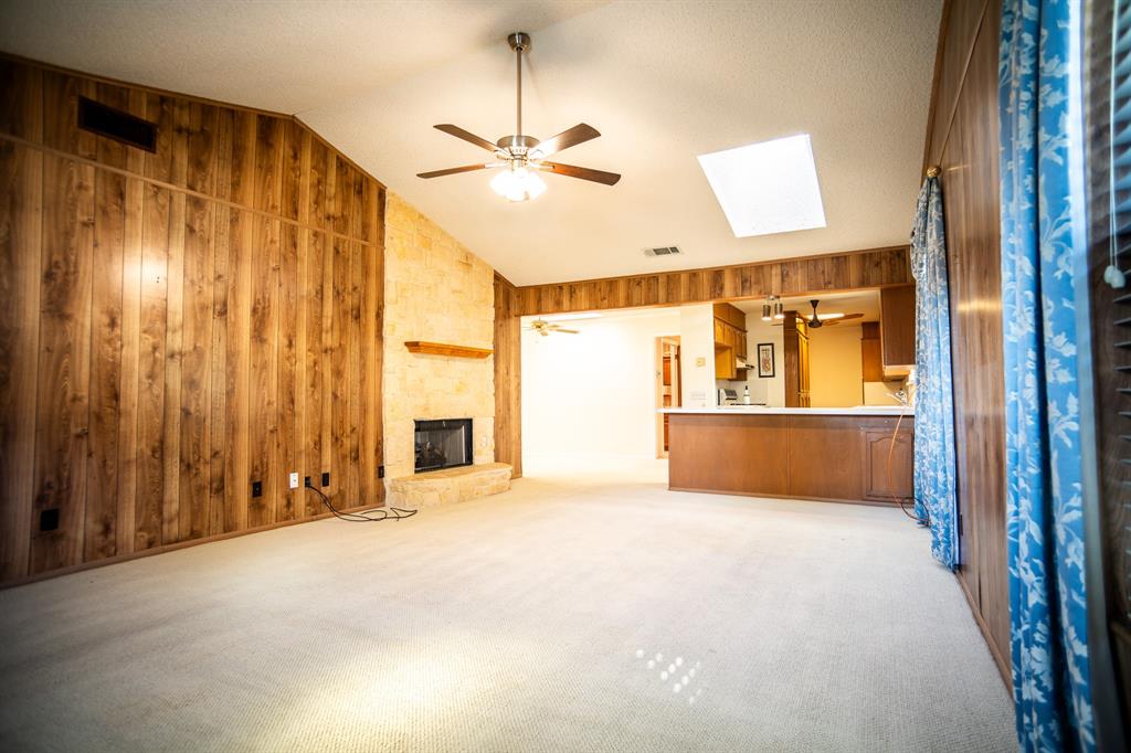 8312 Llano Avenue Benbrook, TX 76116 - Photo 20 of 40 a view of an empty room with a fireplace and a window