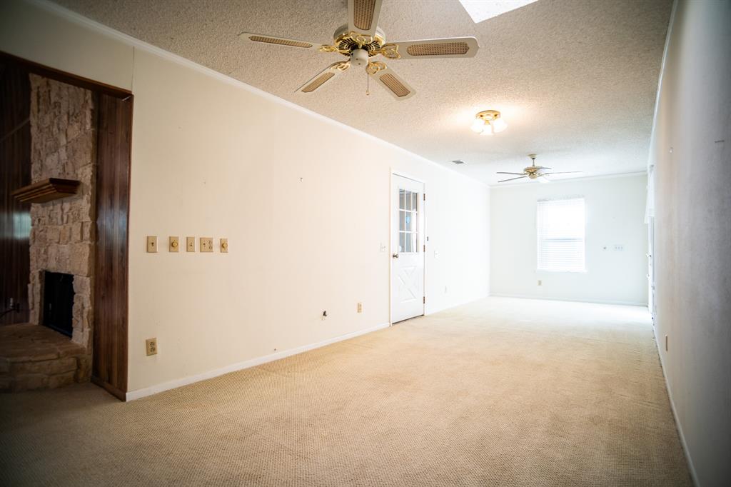 8312 Llano Avenue Benbrook, TX 76116 - Photo 22 of 40 en empty room with windows and fan