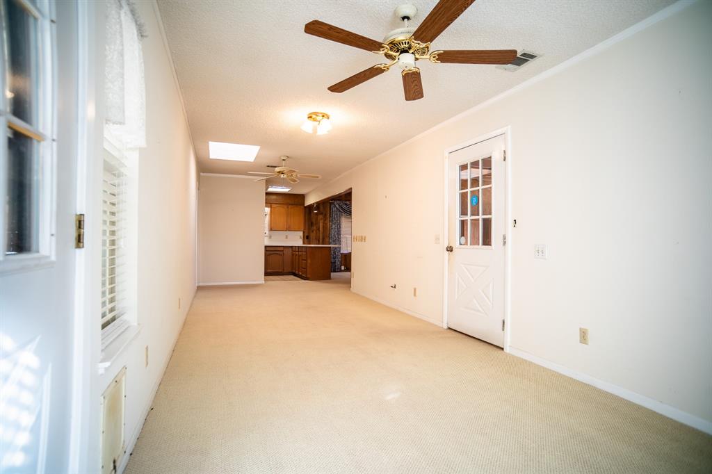 8312 Llano Avenue Benbrook, TX 76116 - Photo 23 of 40 a view of empty room with a kitchen