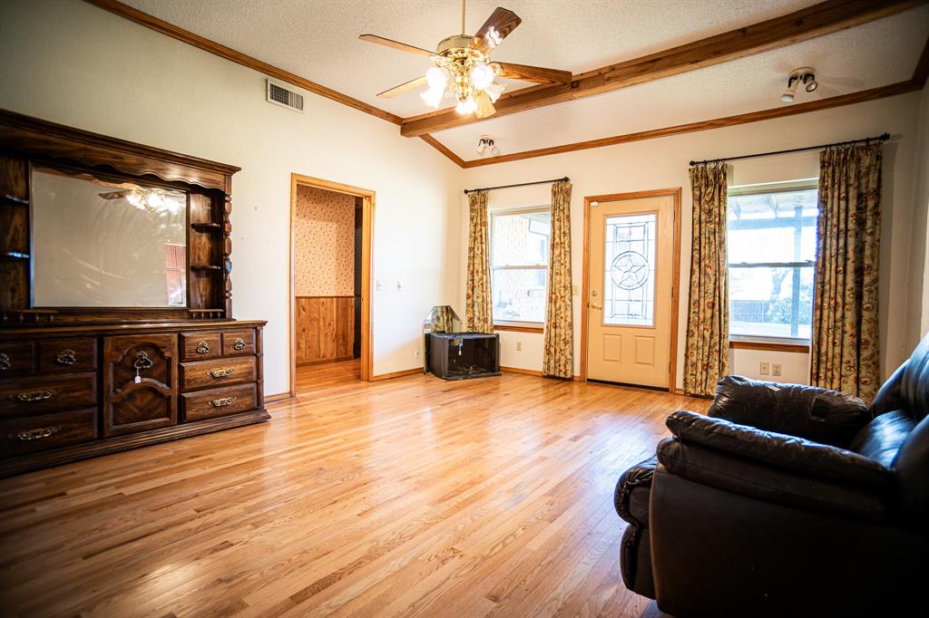 8312 Llano Avenue Benbrook, TX 76116 - Photo 27 of 40 a living room with furniture and a flat screen tv