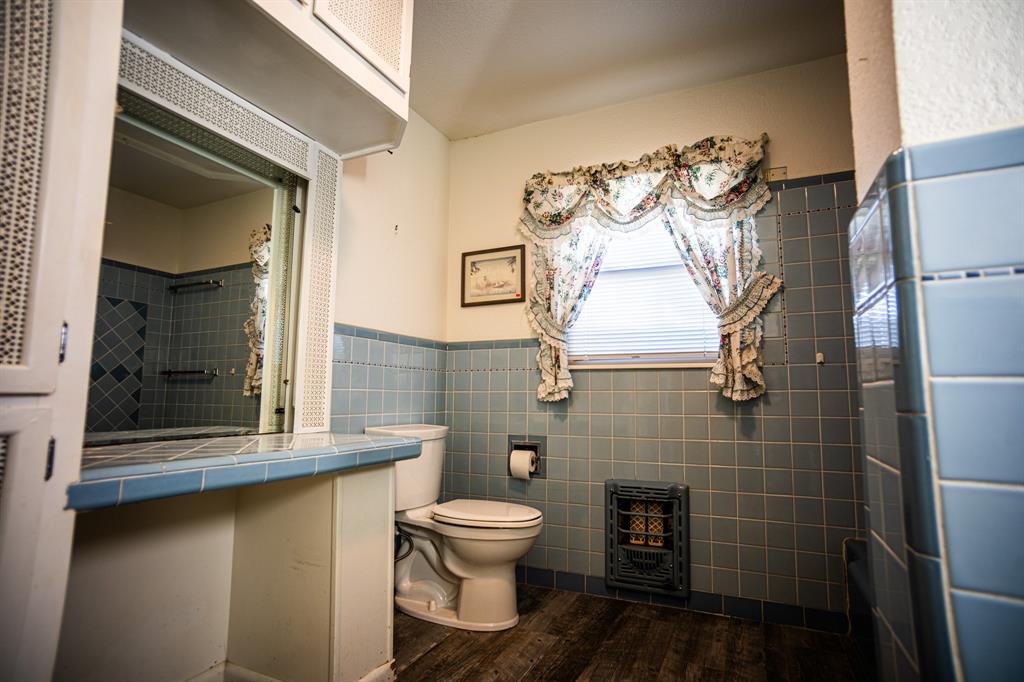 8312 Llano Avenue Benbrook, TX 76116 - Photo 30 of 40 a bathroom with a toilet and a sink