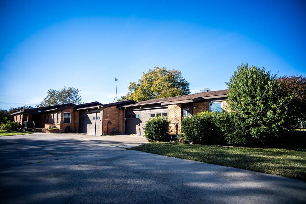 8312 Llano Avenue Benbrook, TX 76116 - Photo 3 of 40 a view of a house with a yard