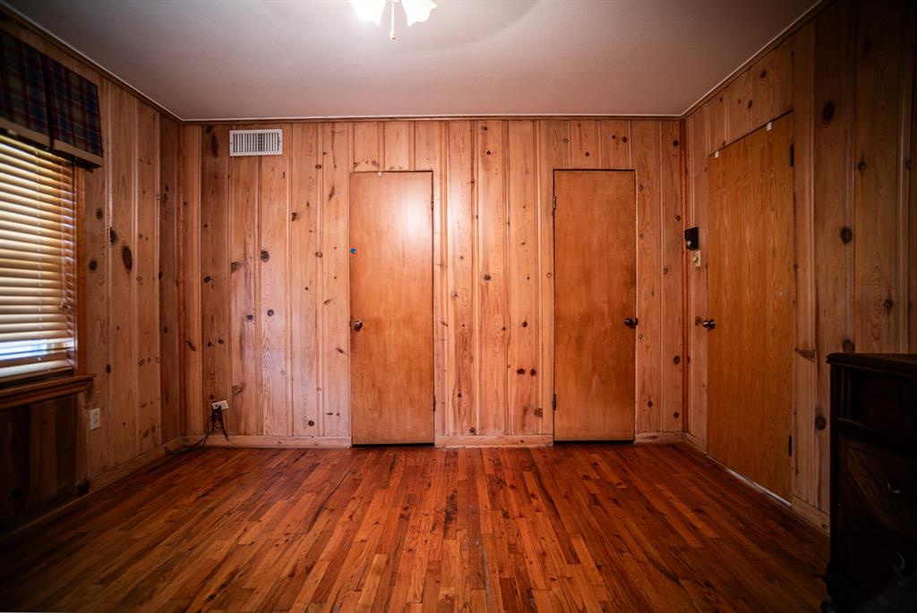8312 Llano Avenue Benbrook, TX 76116 - Photo 32 of 40 a view of a hallway with wooden floor