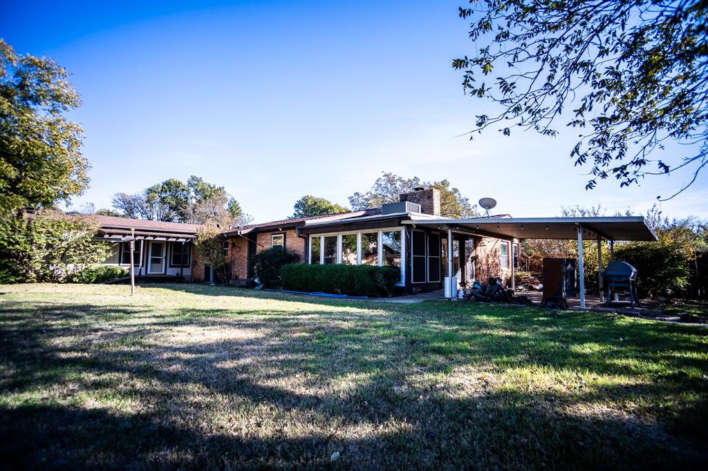 8312 Llano Avenue Benbrook, TX 76116 - Photo 6 of 40 a view of a house with a yard