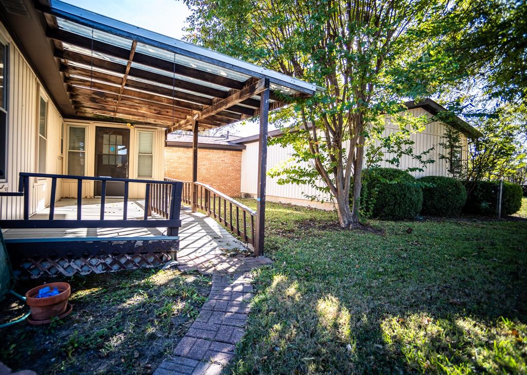 8312 Llano Avenue Benbrook, TX 76116 - Photo 8 of 40 a view of a house with a yard