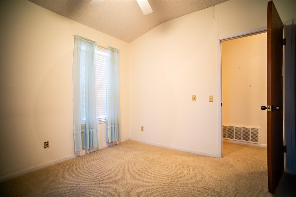8312 Llano Avenue Benbrook, TX 76116 - Photo 9 of 40 an empty room with sliding door