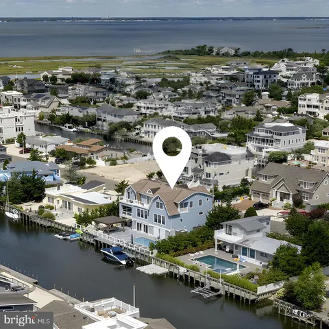 an aerial view of a house with a ocean view