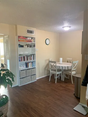 a dining room with a wooden floor and breakfast area