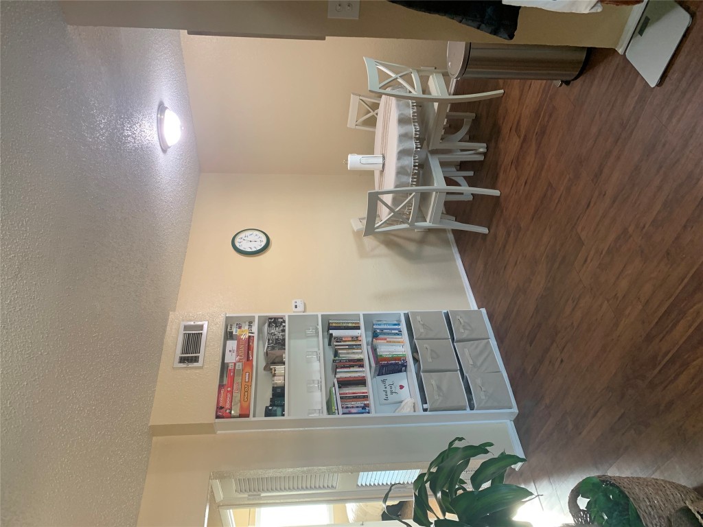 2401 Manor Road, Unit 218 Austin, TX 78722 - Photo 4 of 8 a dining room with a wooden floor and breakfast area