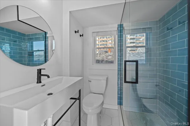 a view of a livingroom with a dishwasher and kitchen view