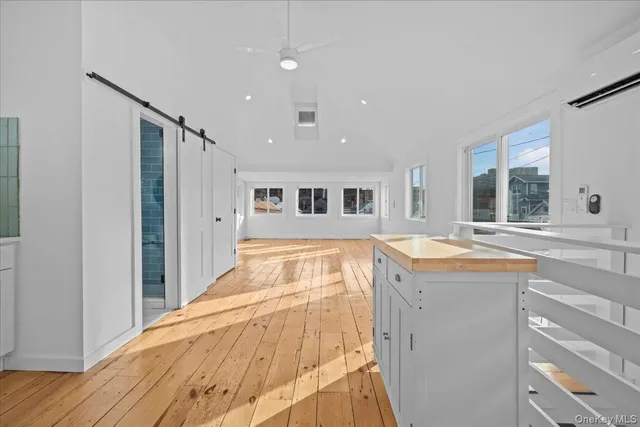 a view of a balcony with wooden floor
