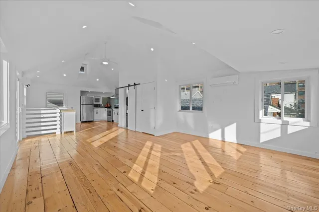 a spacious bathroom with a tub and shower