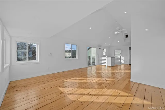 a large empty space with wooden floor