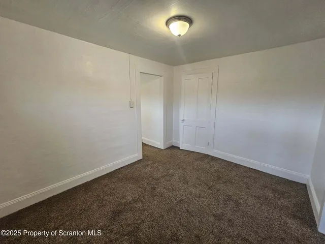an empty room with an entryway