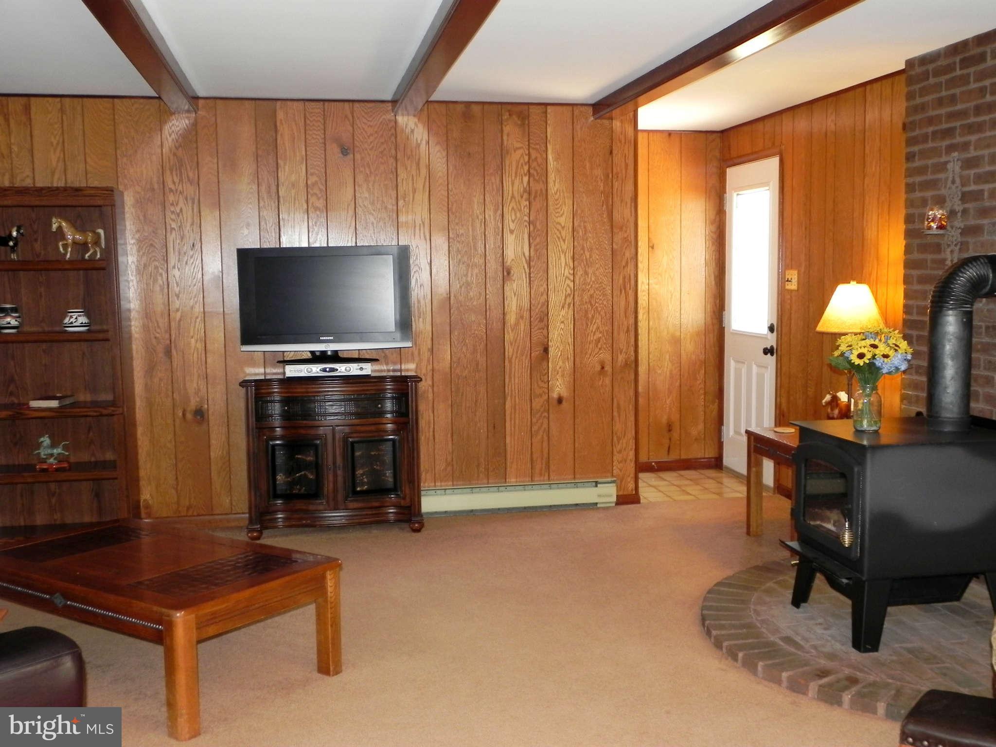 582 Earle Road Charles Town, WV 25414 - Photo 8 of 29 Family Room w/ Paneled Walls