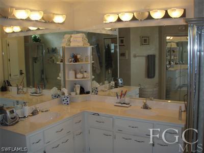 9167 Henry Road Fort Myers, FL 33967 - Photo 7 of 10 a bathroom with a sink and a mirror