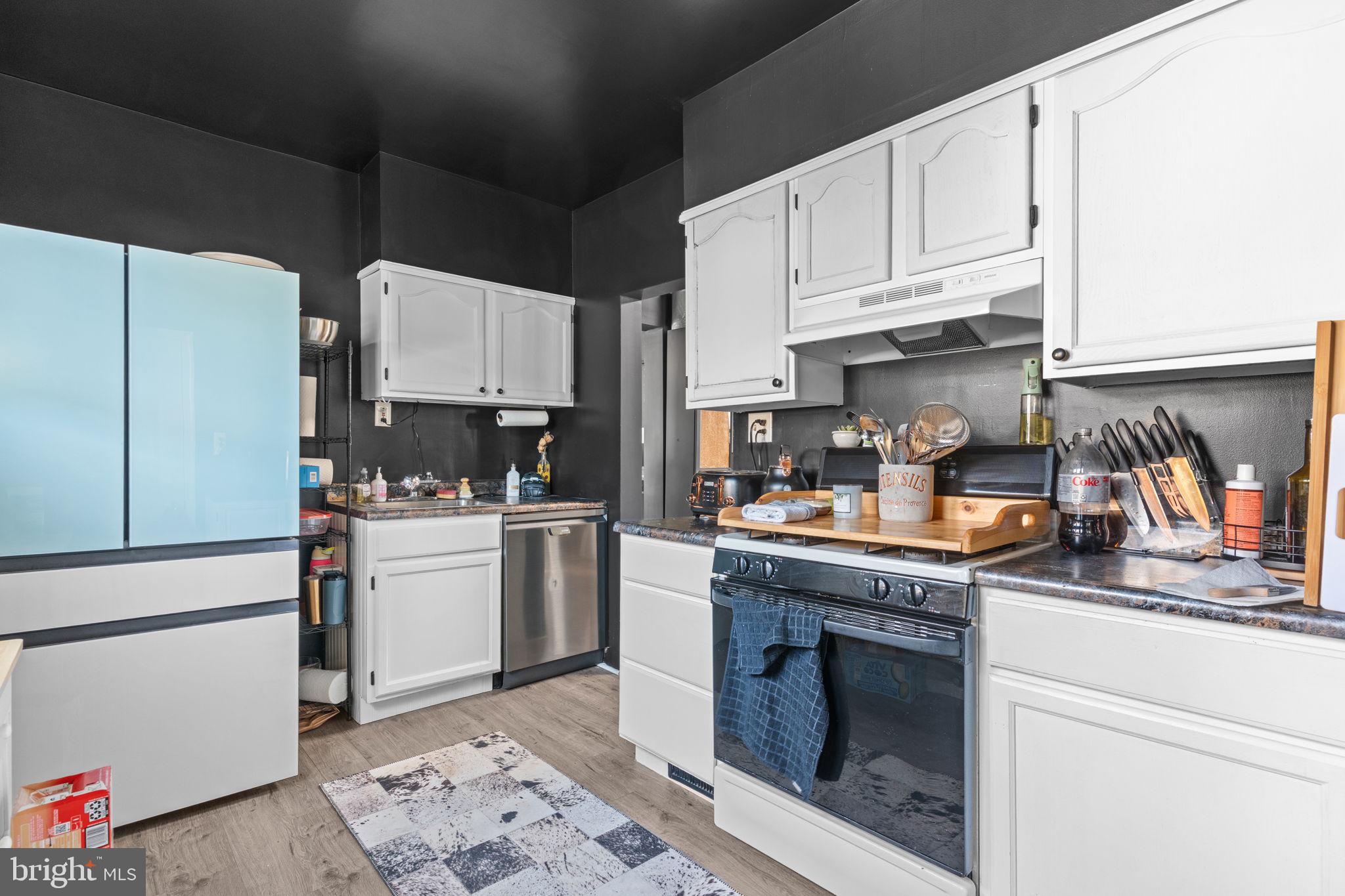 2114 Redwood Avenue Upper Chichester, PA 19061 - Photo 11 of 33 a kitchen with granite countertop a sink stainless steel appliances and cabinets