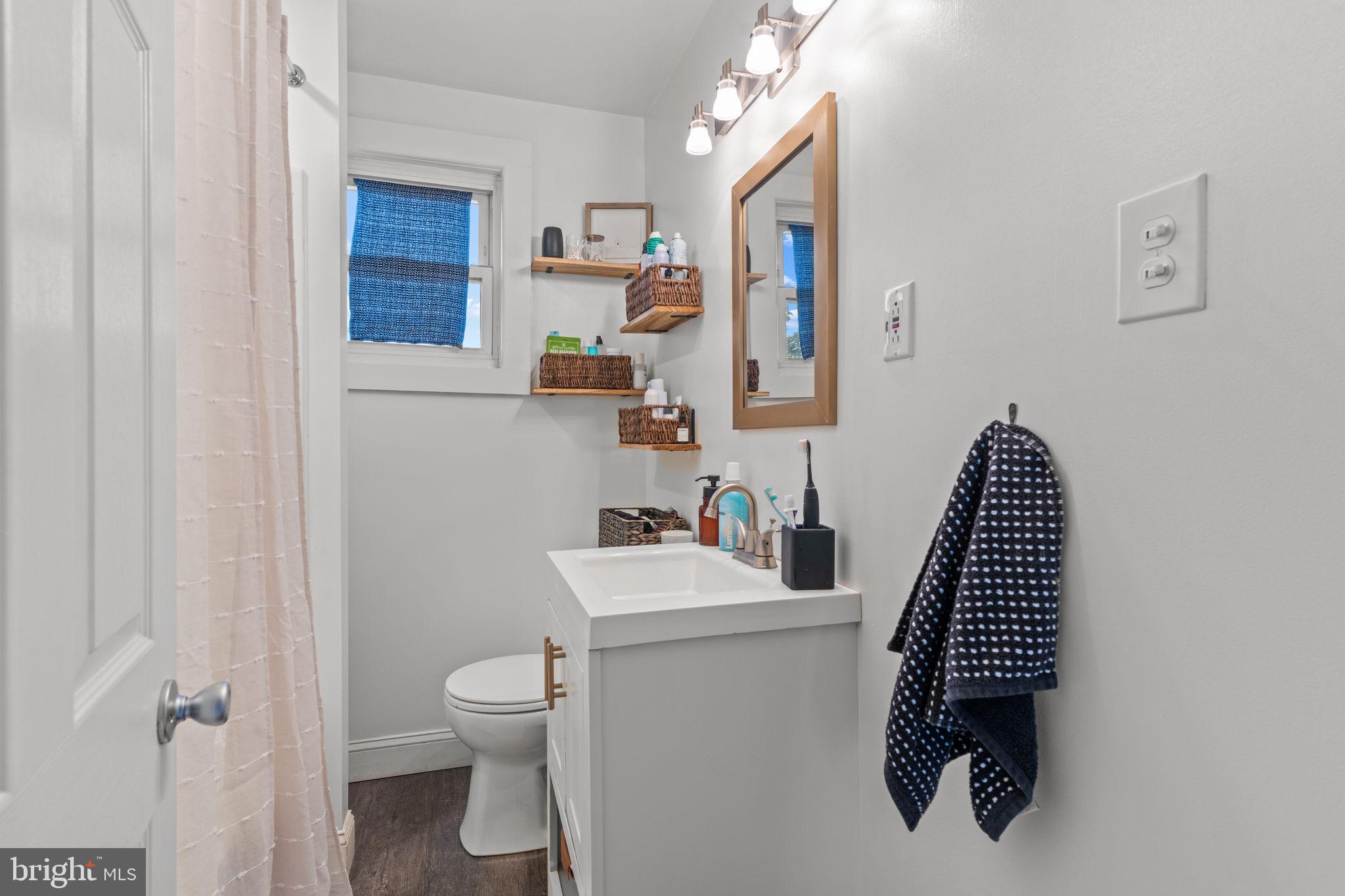 2114 Redwood Avenue Upper Chichester, PA 19061 - Photo 14 of 33 a bathroom with a sink toilet and vanity