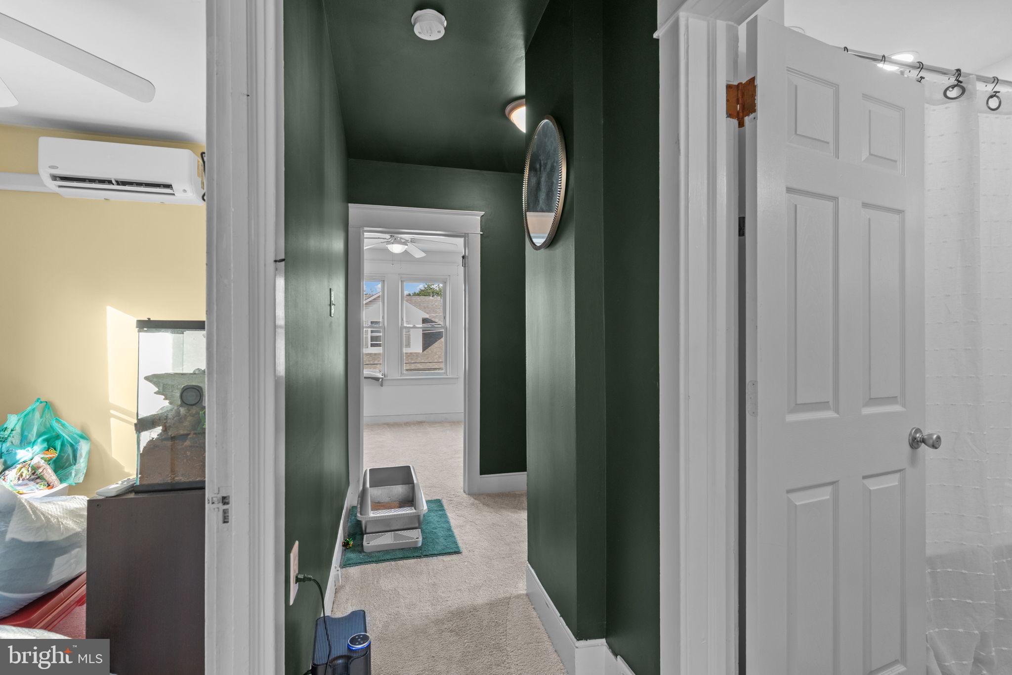 2114 Redwood Avenue Upper Chichester, PA 19061 - Photo 17 of 33 a bathroom with a glass door shower and a mirror