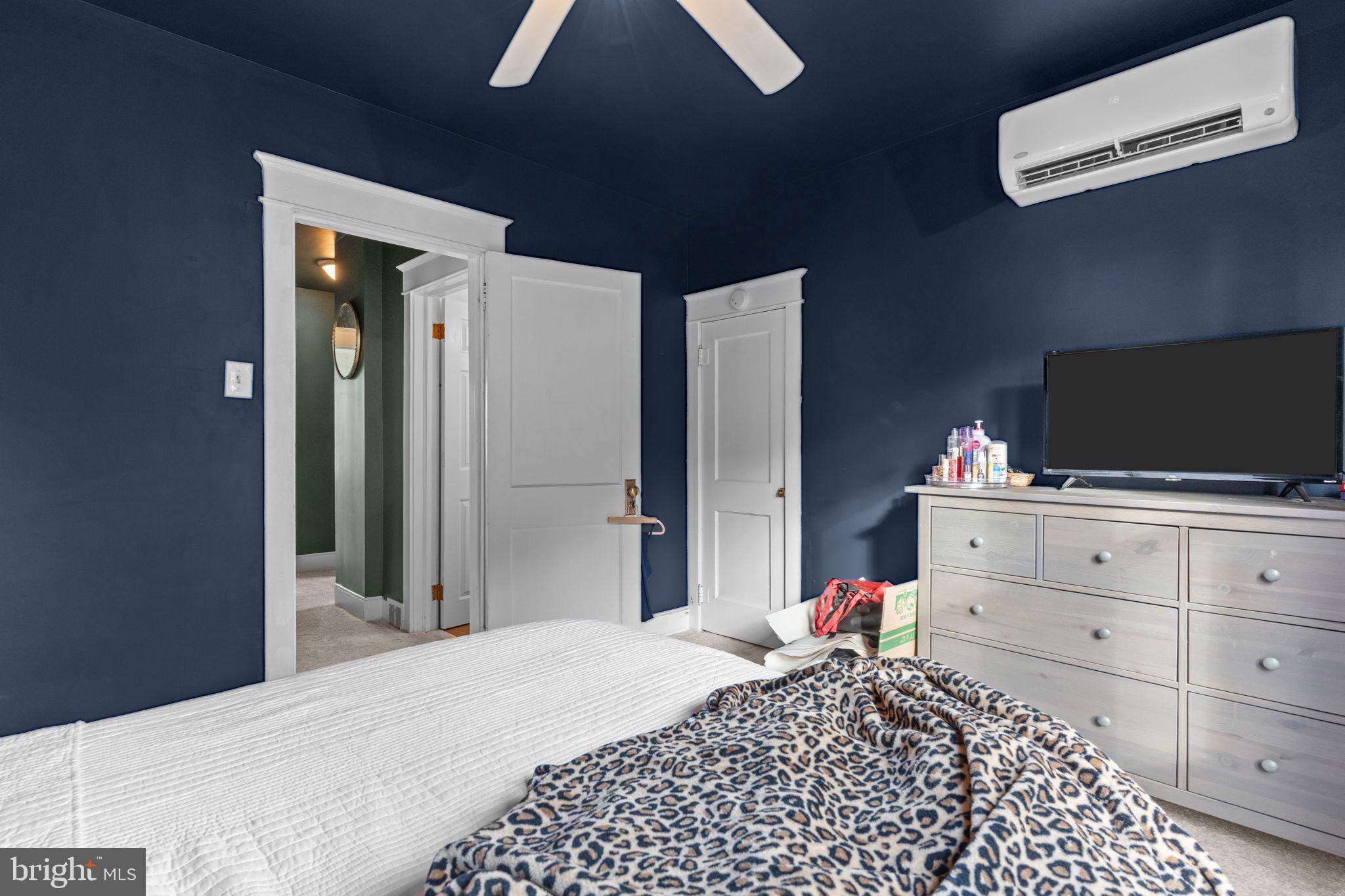 2114 Redwood Avenue Upper Chichester, PA 19061 - Photo 19 of 33 a bedroom with a bed and a flat tv screen on dresser