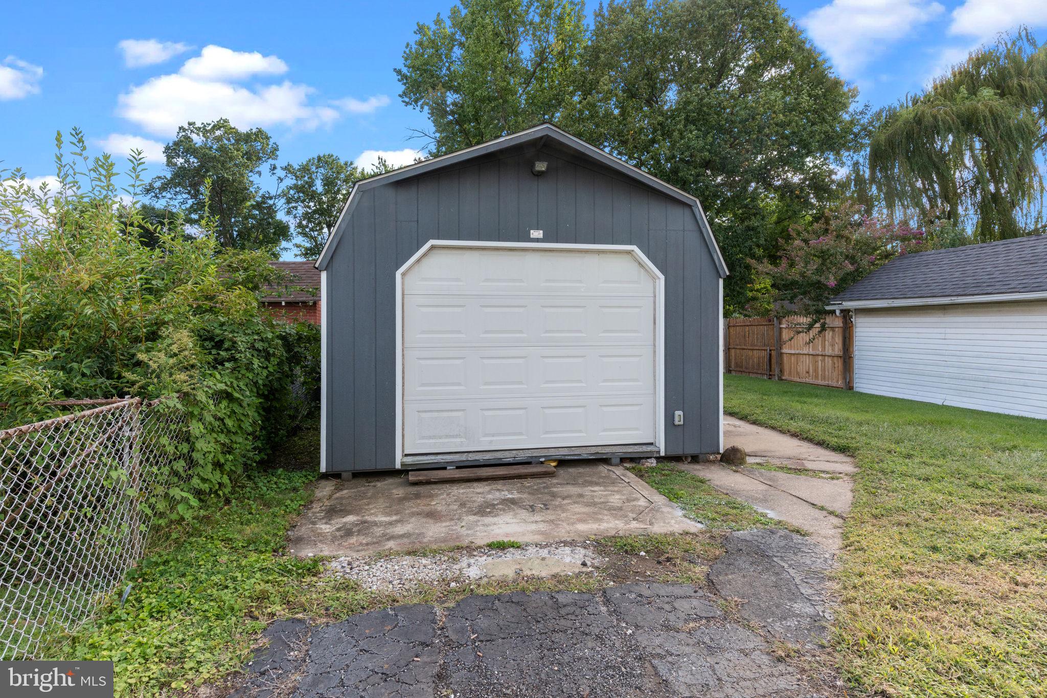 2114 Redwood Avenue Upper Chichester, PA 19061 - Photo 27 of 33 a front view of a house with a garden