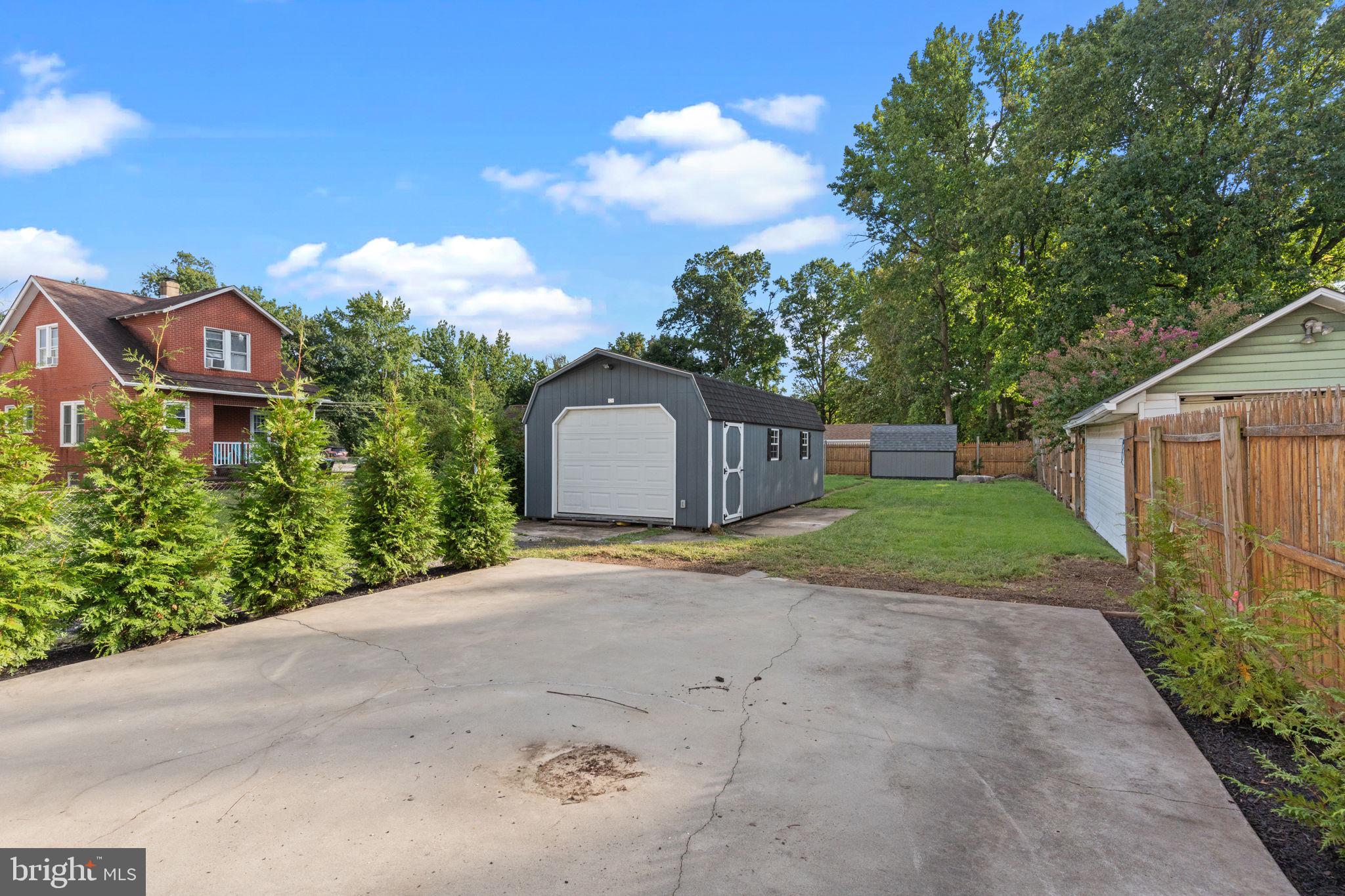 2114 Redwood Avenue Upper Chichester, PA 19061 - Photo 30 of 33 a front view of a house with a yard and garage