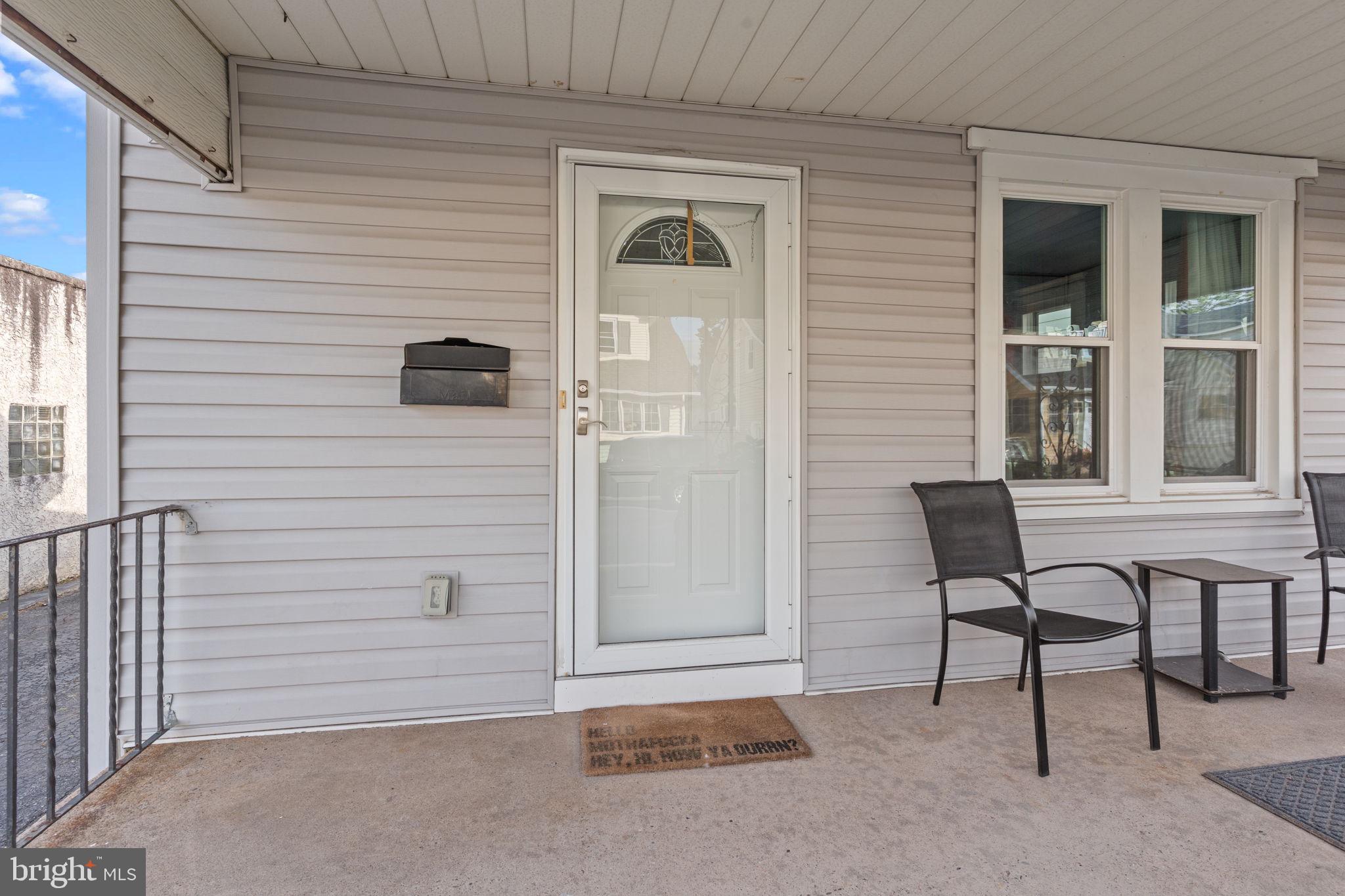 2114 Redwood Avenue Upper Chichester, PA 19061 - Photo 4 of 33 a view of a door and chair in front of the house