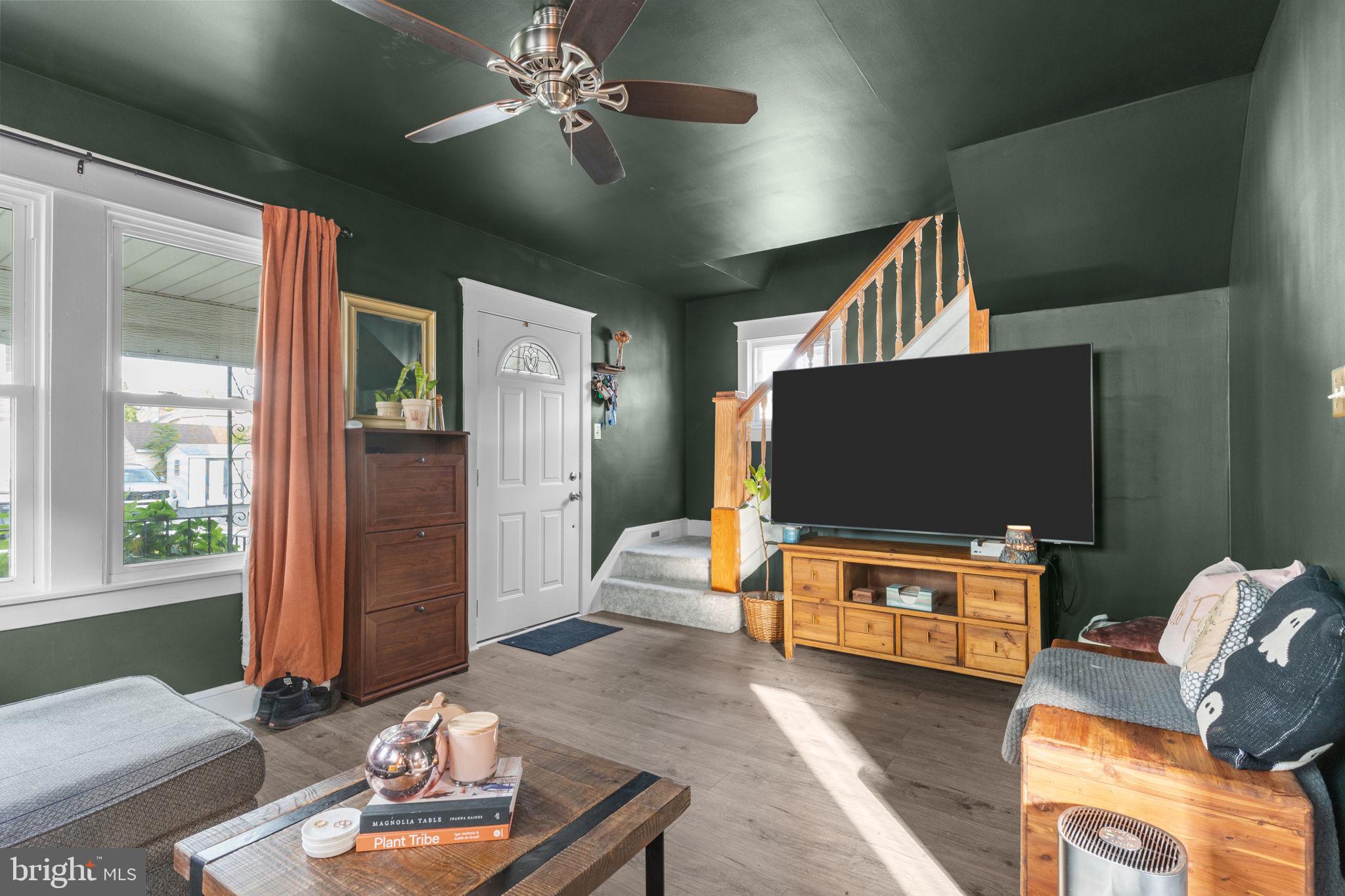2114 Redwood Avenue Upper Chichester, PA 19061 - Photo 5 of 33 a living room with furniture and a flat screen tv